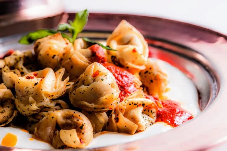 Tortellini in broth with a spoon